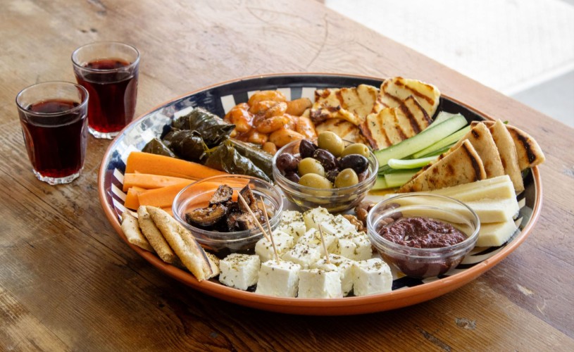 Plate of Greek food - olives, feta, pitta, halloumi and more - from The Real Greek marketplace